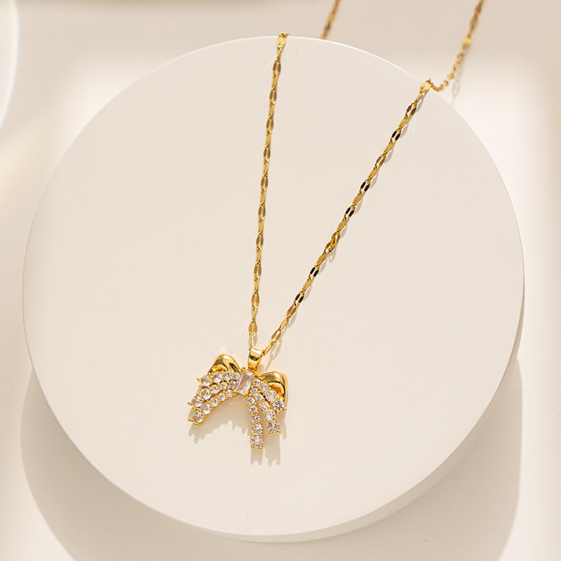 Collar minimalista con lazo para mujer, colgante de acero titanio con incrustaciones de diamantes de imitación y cadena ondulada