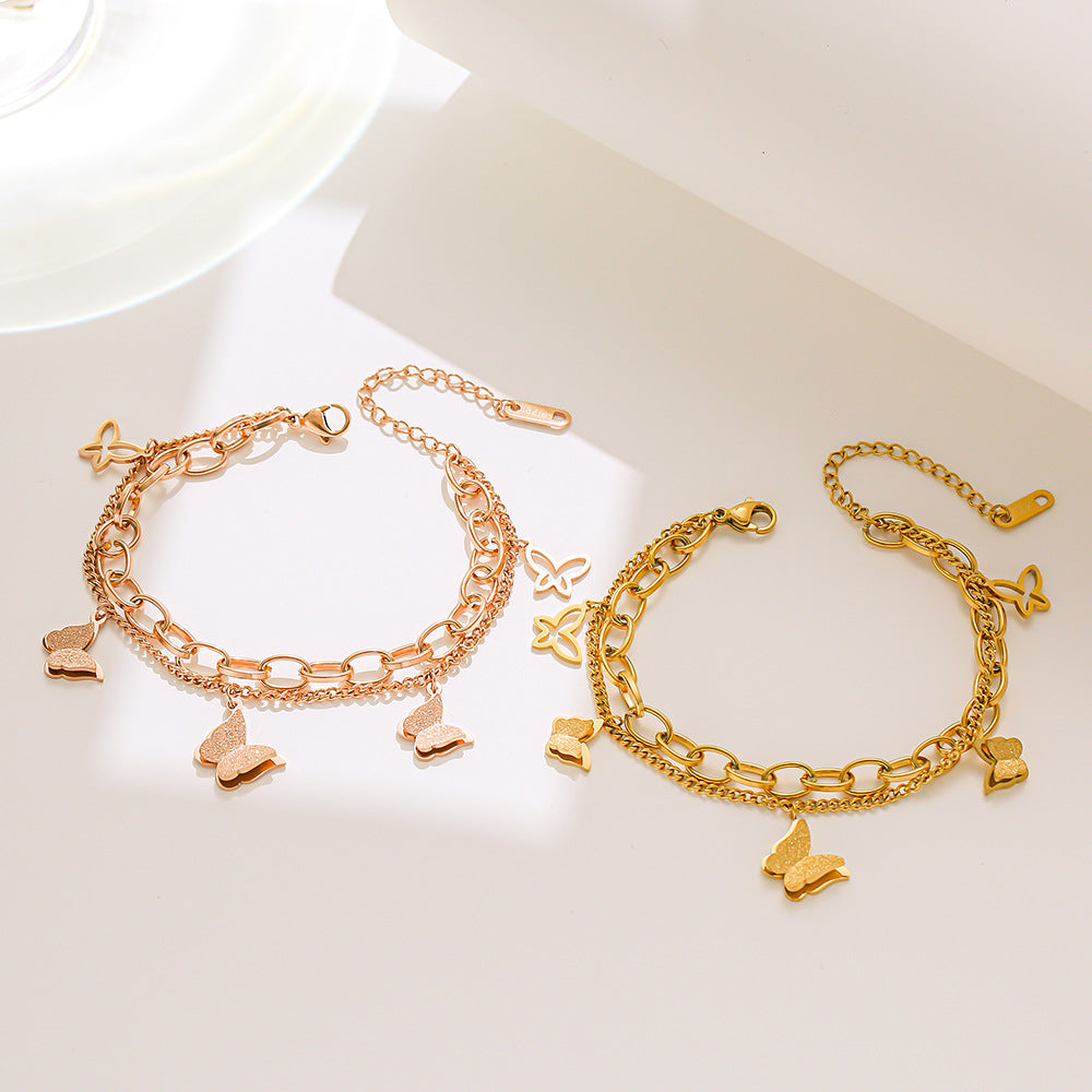 Bracciale a doppia farfalla in acciaio al titanio placcato oro rosa da donna con design geometrico e stile minimalista alla moda