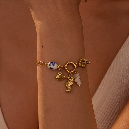 Fashionable Ocean Vacation Style Seashell and Shell Shaped Stainless Steel Bracelet with Geometric Design and Plated Finish for Women