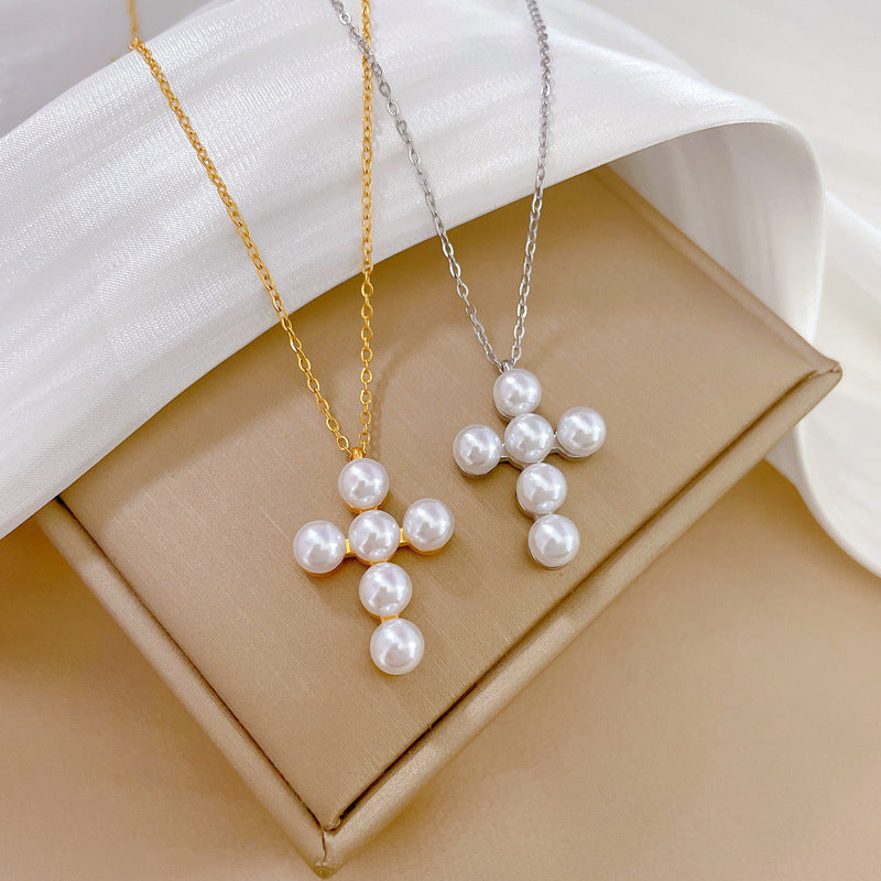 Collana a croce geometrica minimalista in acciaio al titanio con accento floreale