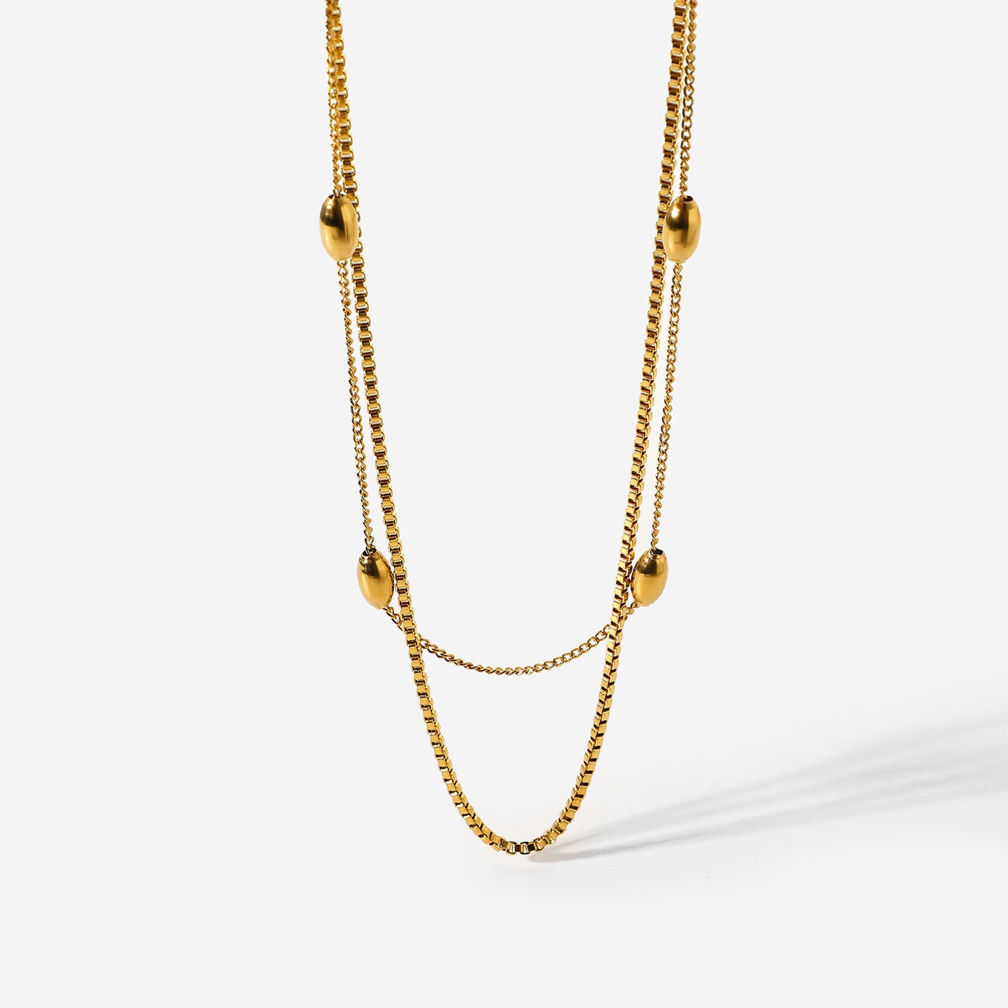 Elegante collar de mujer de doble capa con cuentas ovaladas, de acero inoxidable chapado en oro de 18 quilates