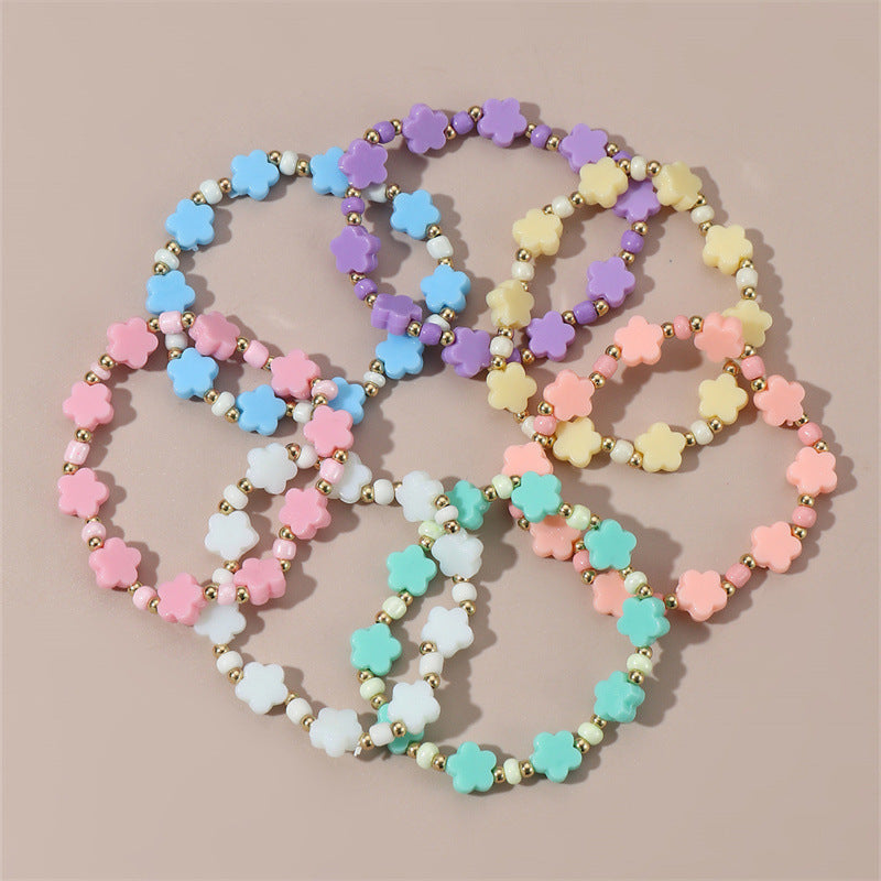 Braccialetto Minimalista a Stella con Perline per Bambini Realizzato in Plastica e Resina con Accenti Floreali Colorati
