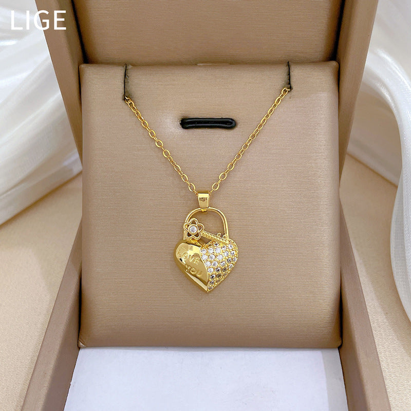 Elegante collana da donna con ciondolo a cuore floreale in strass e catena in acciaio al titanio con design geometrico