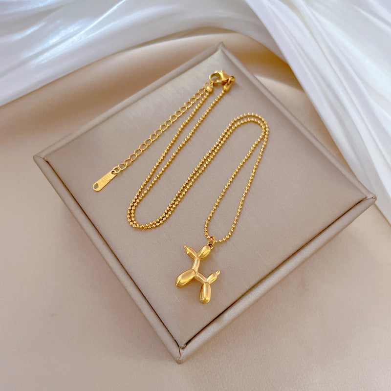 Collana con Ciondolo a Cane Geometrico Minimalista in Acciaio al Titanio per Donna e Uomo con Finitura Placcata Oro e Design a Catena Clavicolare
