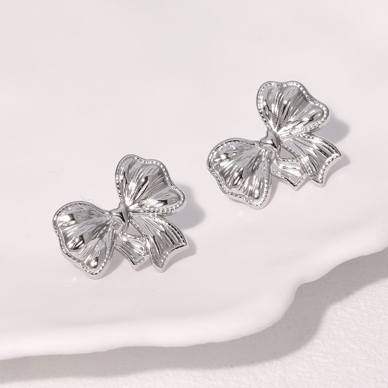 Pendientes minimalistas de acero inoxidable con forma de lazo y acabado chapado para mujer