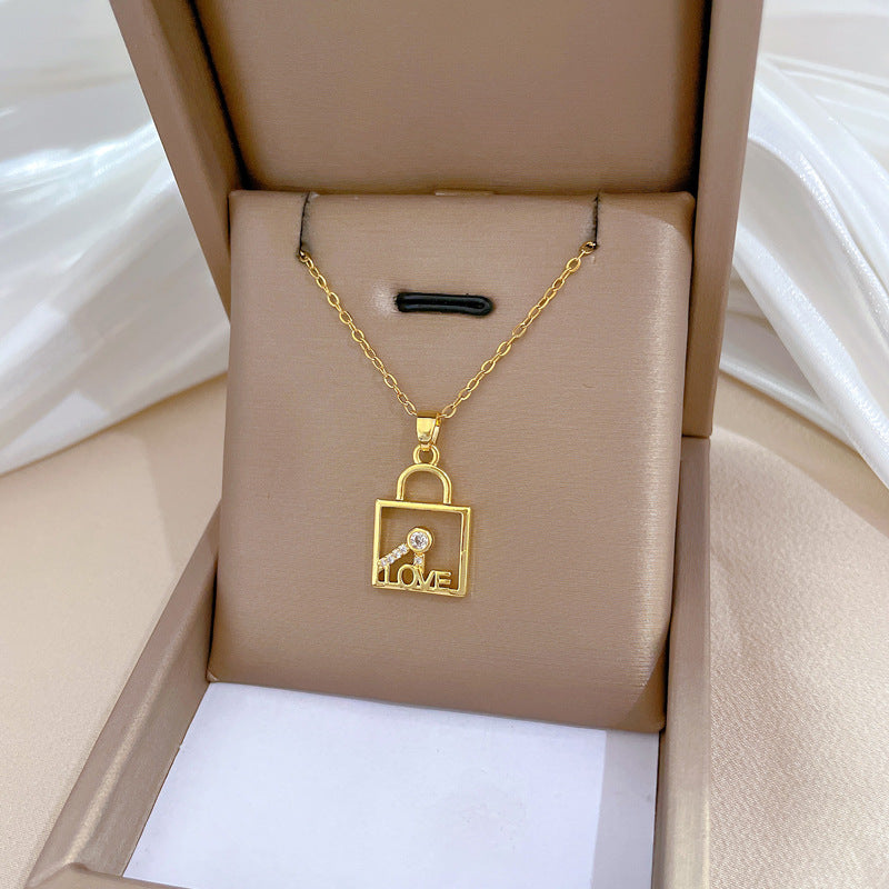 Minimalist Geometric LOVE Key Lock Pendant Necklace for Women and Men in Titanium Steel with Rhinestone Accents on Snake Chain