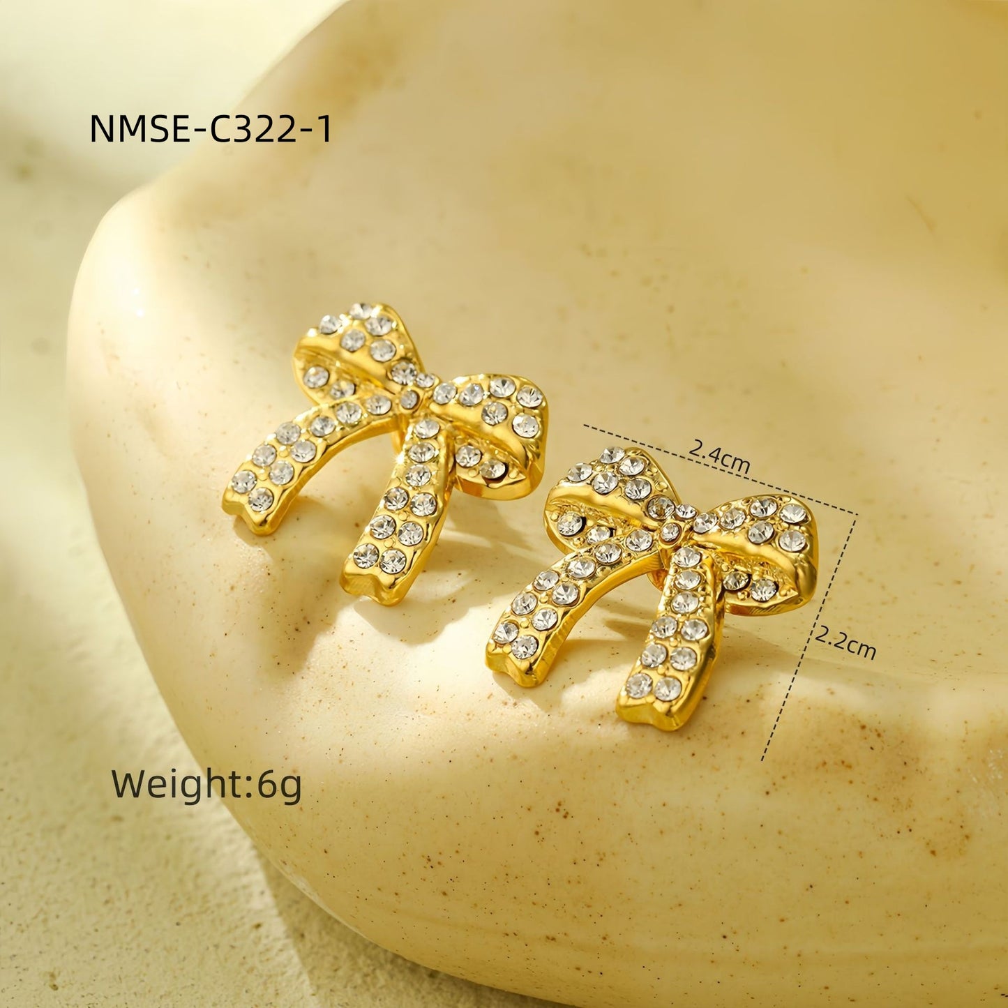 Orecchini di lusso da donna in acciaio al titanio a forma di fiocco con intarsio di strass completo e finitura placcata