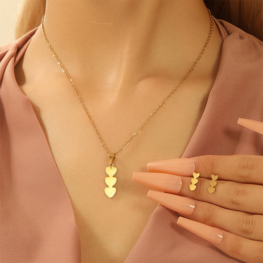 Set di collana e orecchini minimalisti placcati in rame a forma di cuore con dettaglio nappa da donna