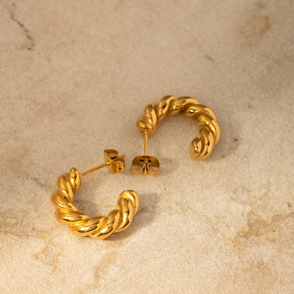 Orecchini a cerchio a spirale geometrica attorcigliata da donna in acciaio inossidabile con placcatura in oro 18 carati