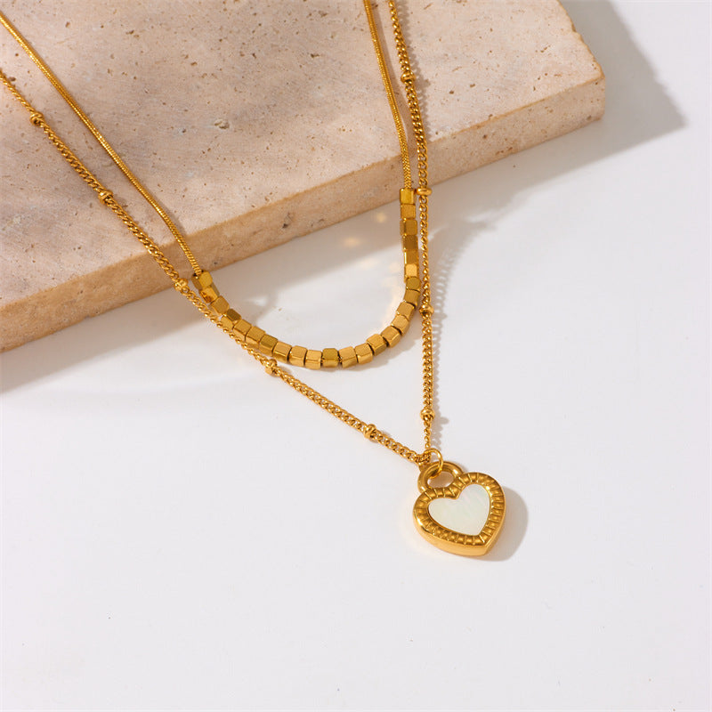 Minimalist Fashion Heart-Shaped Gold-Plated Titanium Steel Double-Layer Necklace with Black and White Heart Pendant