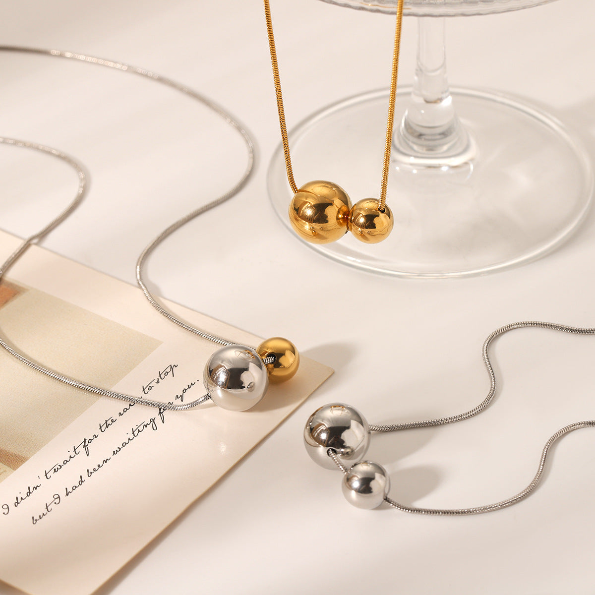 Minimalist Geometric Ball Pendant Necklace in Stainless Steel with Gold and Silver Plated Titanium Steel Accents Snake Chain Collar Jewelry for Women