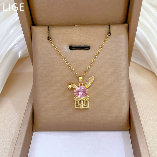 Collar con colgante de conejo con lazo estilo caricatura para mujer con incrustaciones de diamantes de imitación en cadena de acero de titanio