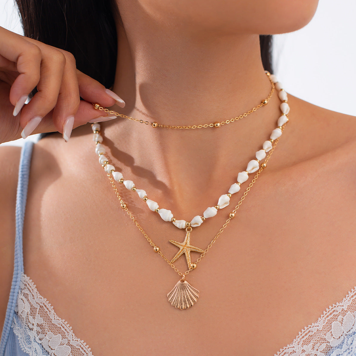 Collana con ciondolo a stella in lega di zinco impilabile con nappa e catena irregolare da donna