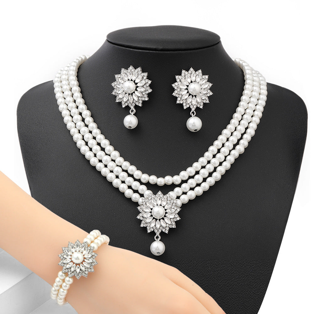 Minimalist Snowflake Pearl Necklace Set with Alloy Pendant and Rhinestone Accents for Women Includes O-Chain Necklace Earrings and Bracelet