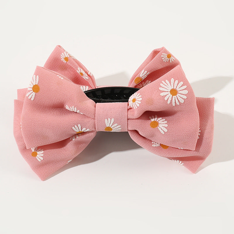 Dulce pasador de tela minimalista con lazo grande y diseño de margarita para niñas