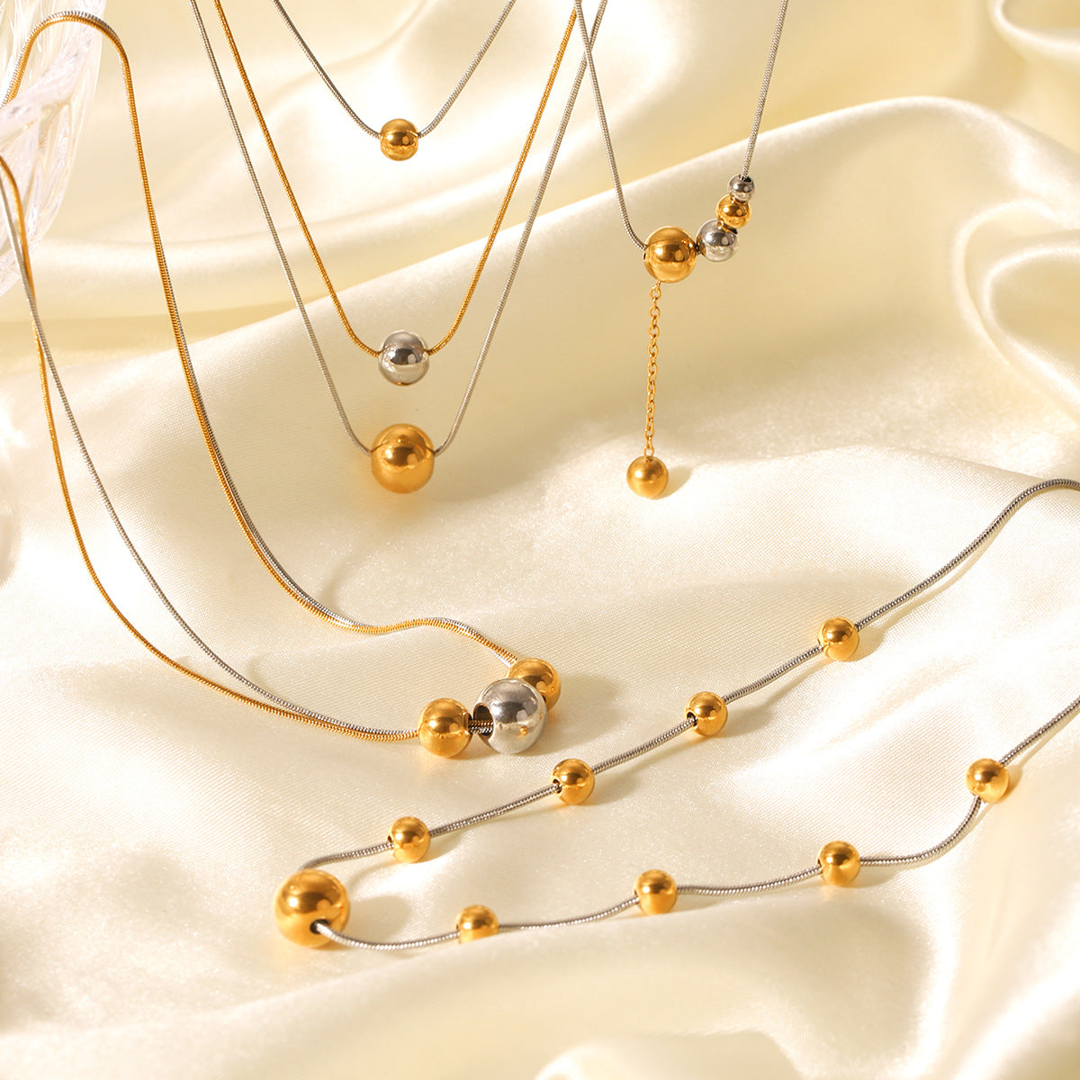 Minimalist Geometric Round Bead Pendant Necklace for Women in Stainless Steel with Titanium Steel Charm and Gold Plated Snake Chain