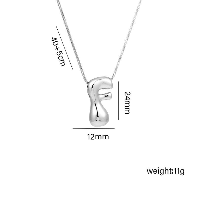 Collar con colgante de acero titanio con forma de letra minimalista y chapado en oro para mujer