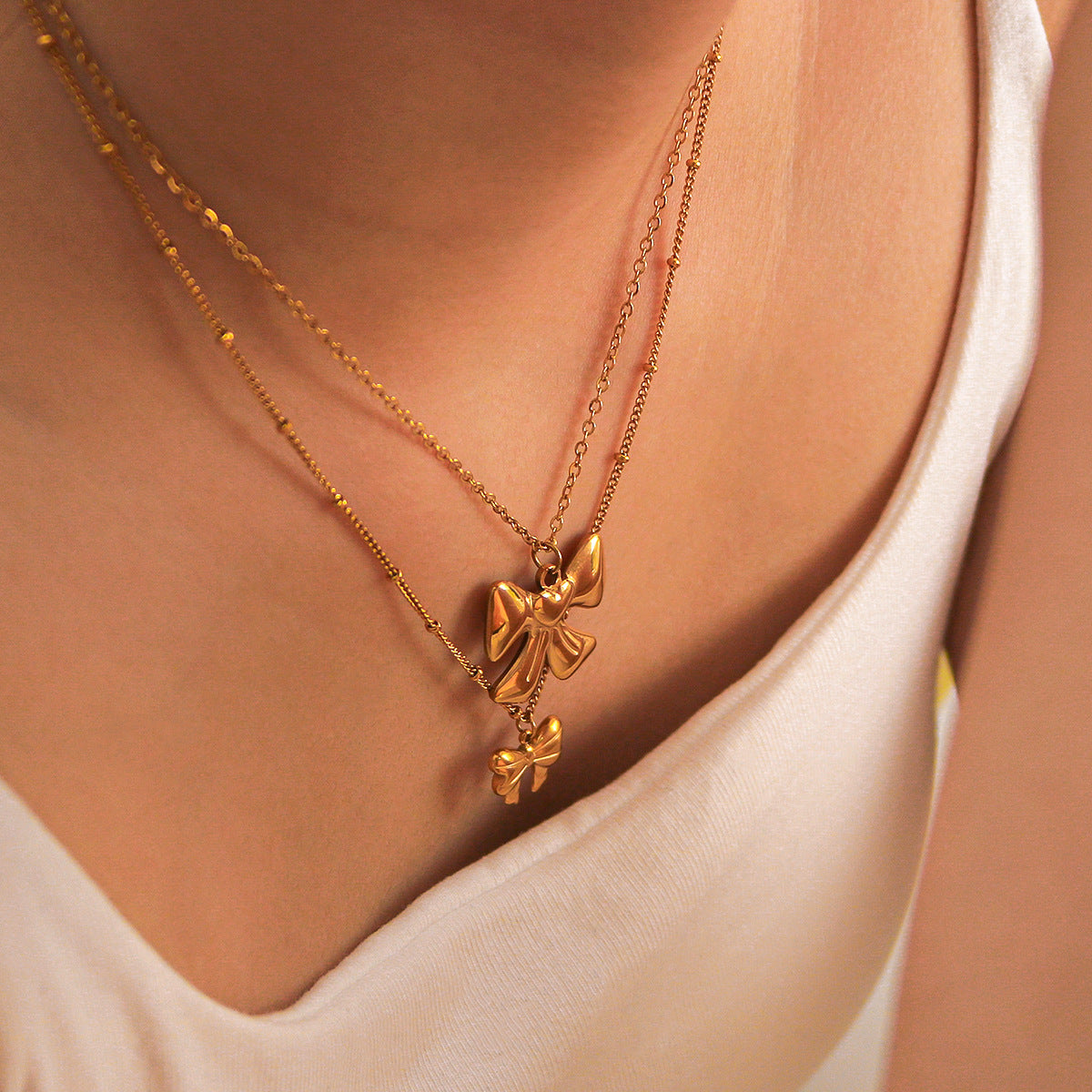 Collana da donna con ciondolo a fiocco geometrico in acciaio inossidabile placcato oro 18 carati, gioiello di moda ipoallergenico