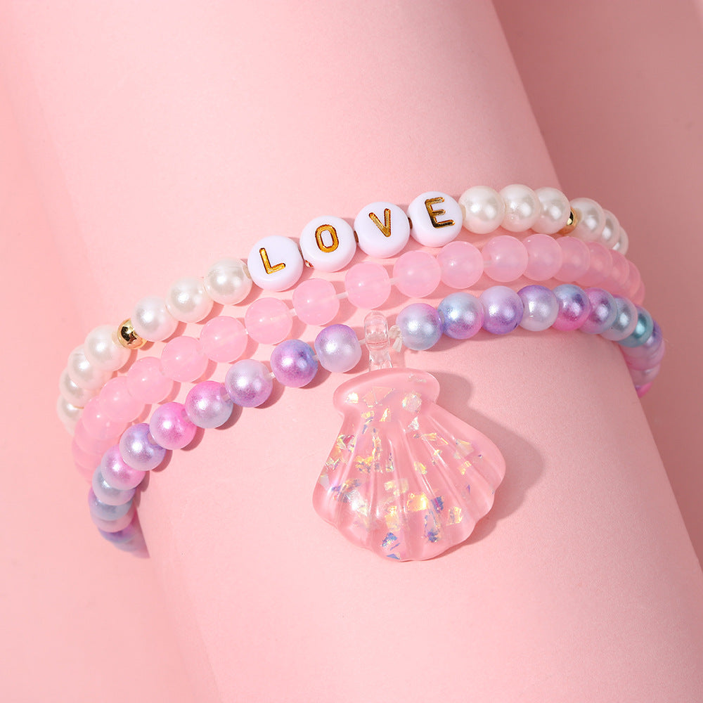 Juego de pulseras de resina con cuentas en forma de corazón estilo caricatura con dijes de cola de sirena y conchas marinas para niños