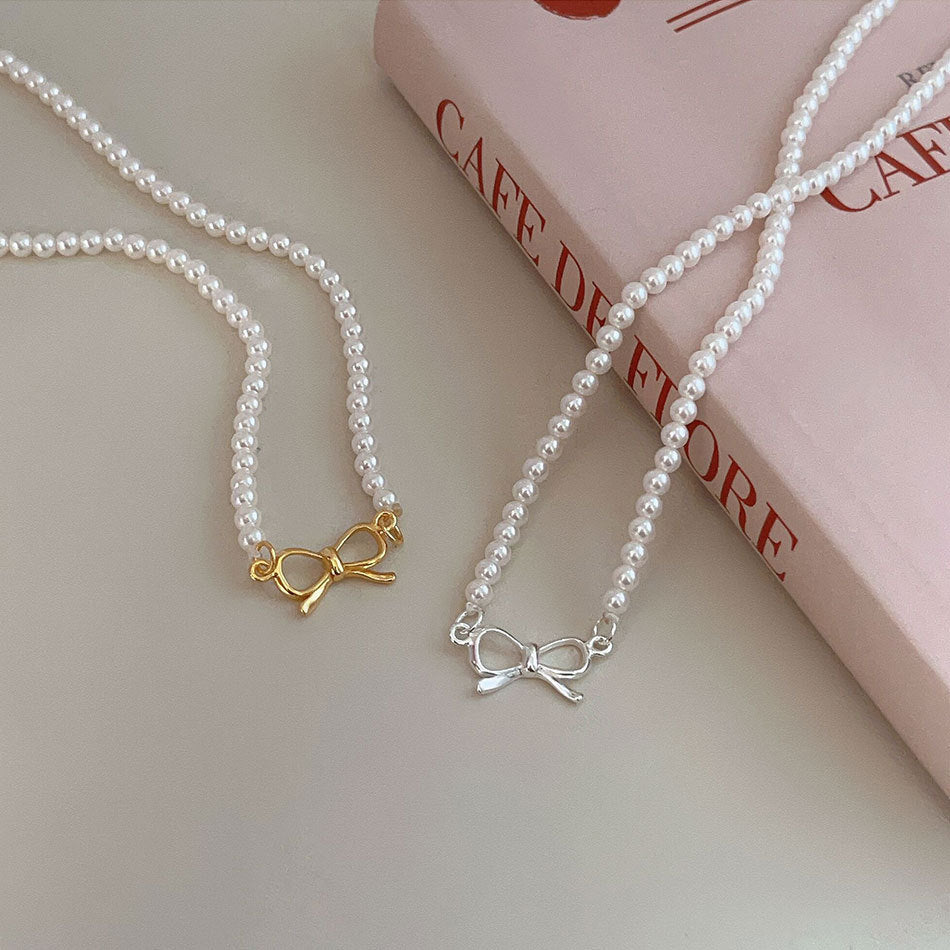 Minimalist Bowknot Pendant Necklace in 925 Sterling Silver with Rhinestone and Pearl Accents on Cross Chain