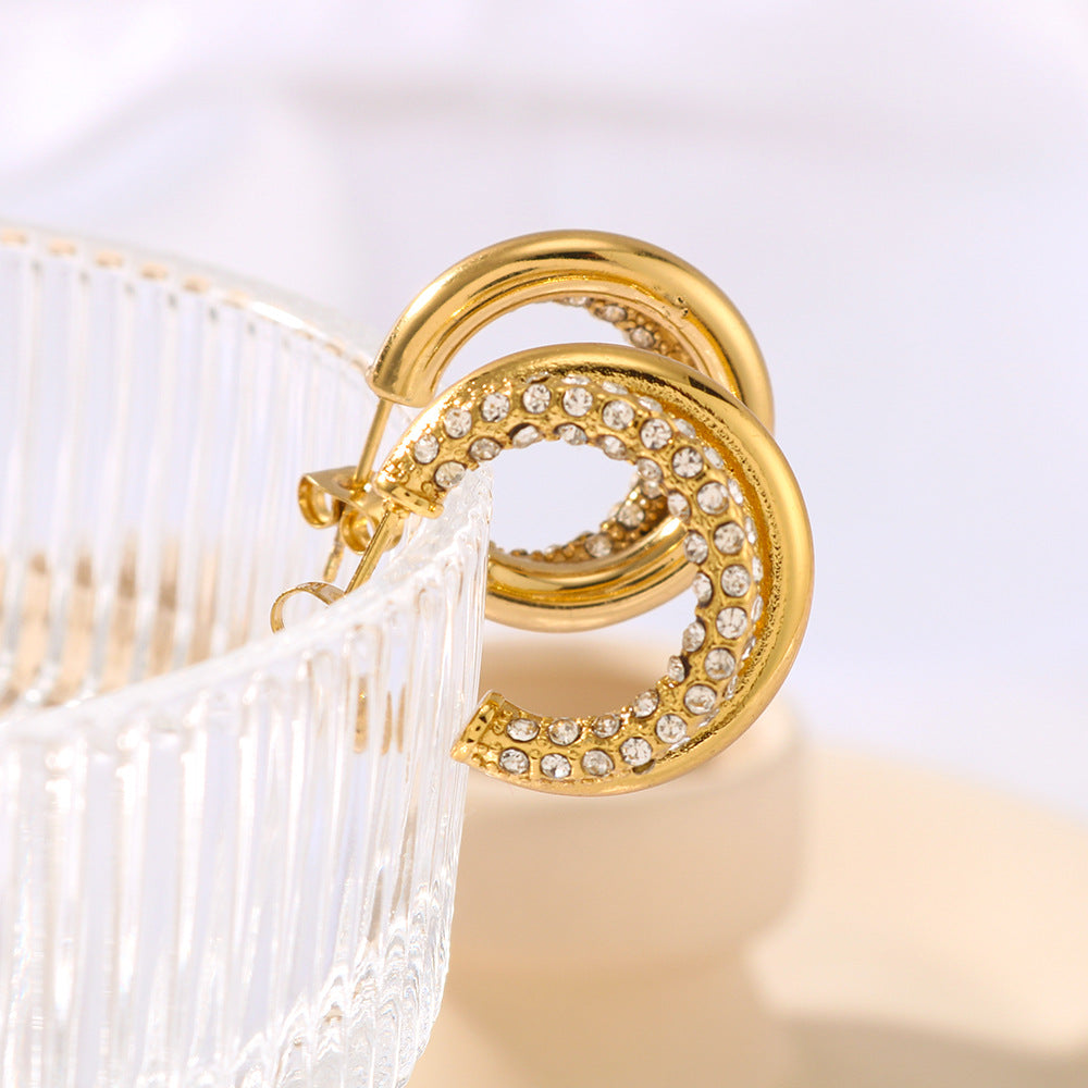 Aretes minimalistas de acero de titanio geométricos con baño de oro de 18 quilates y detalles de diamantes de imitación para mujer