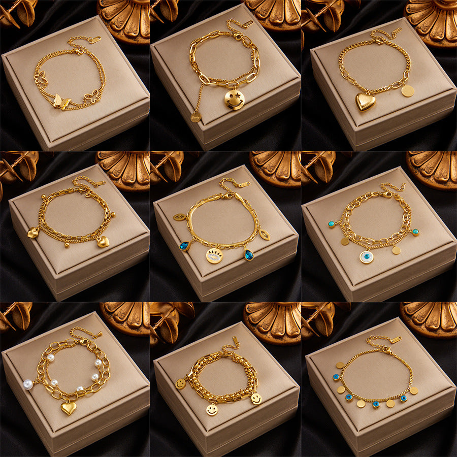 Bracciale Minimalista in Acciaio al Titanio a Strati con Ciondolo a Cuore, Cerchio, Sorriso, Farfalla e Occhio