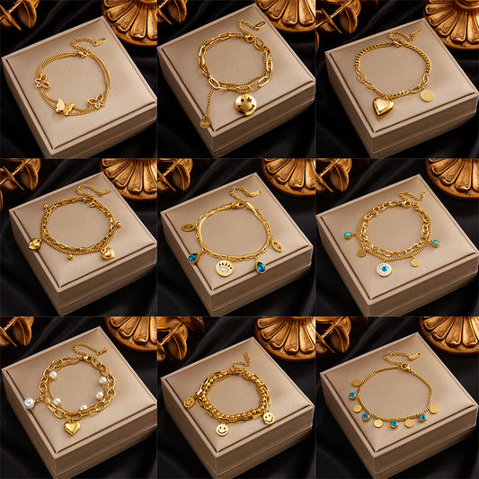 Pulsera minimalista de acero de titanio multicapa con colgante de ojo de mariposa, círculo y corazón sonriente