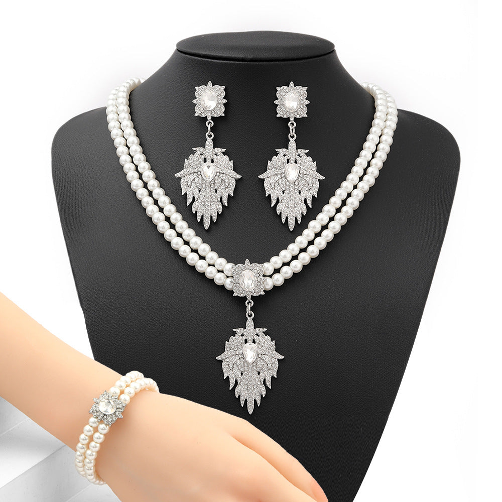 Minimalist Snowflake Pearl Necklace Set with Alloy Pendant and Rhinestone Accents for Women Includes O-Chain Necklace Earrings and Bracelet
