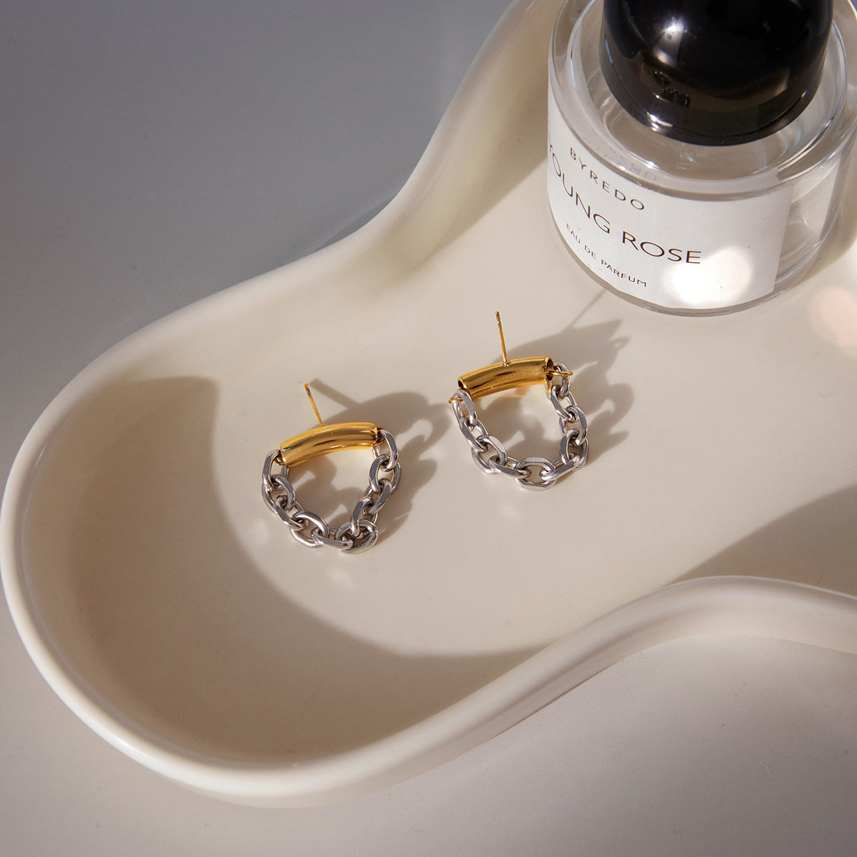 Orecchini geometrici pendenti da donna in acciaio inossidabile con finitura placcata, polsini di lusso