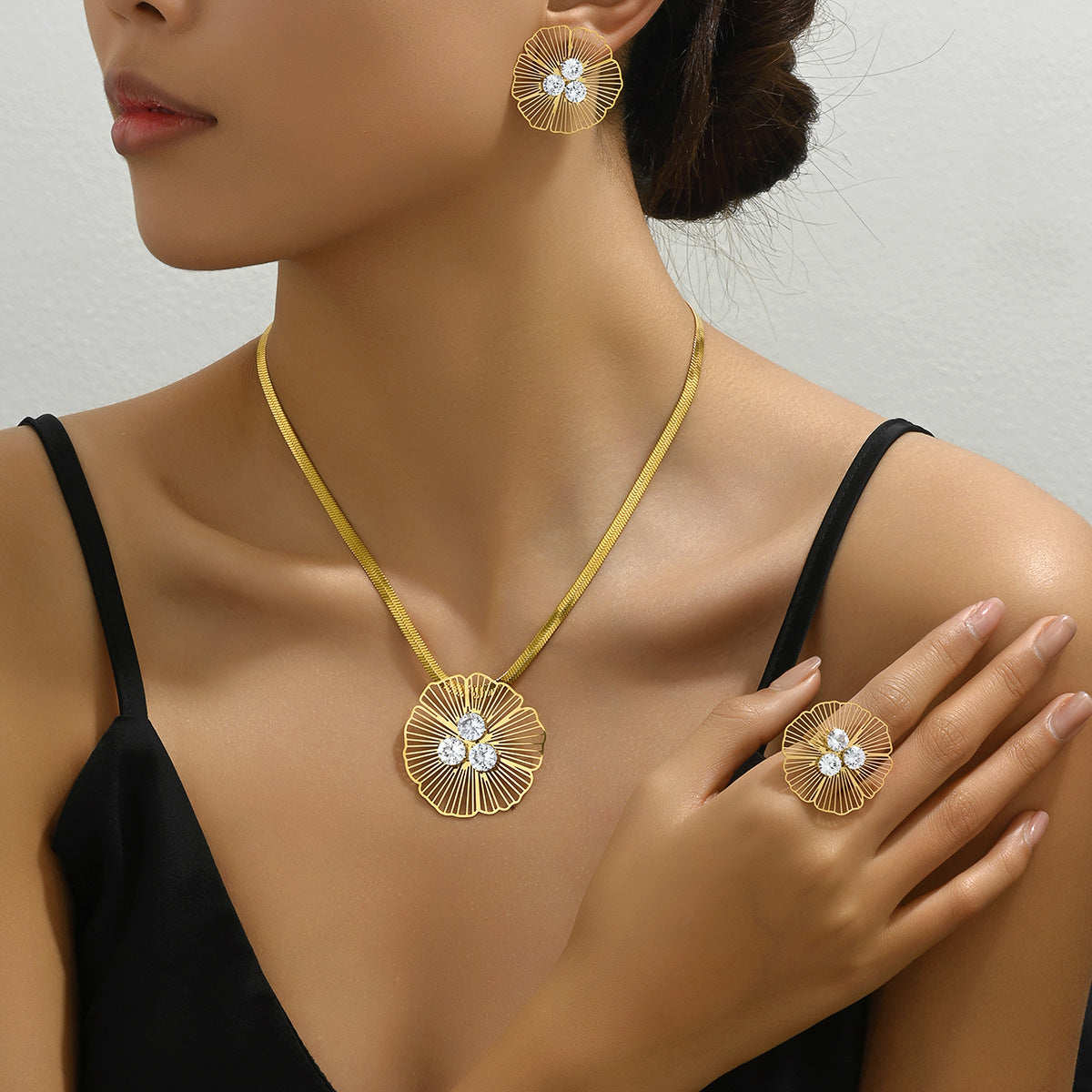 Set di collana e orecchini in rame floreale minimalista con zirconi intarsiati da donna