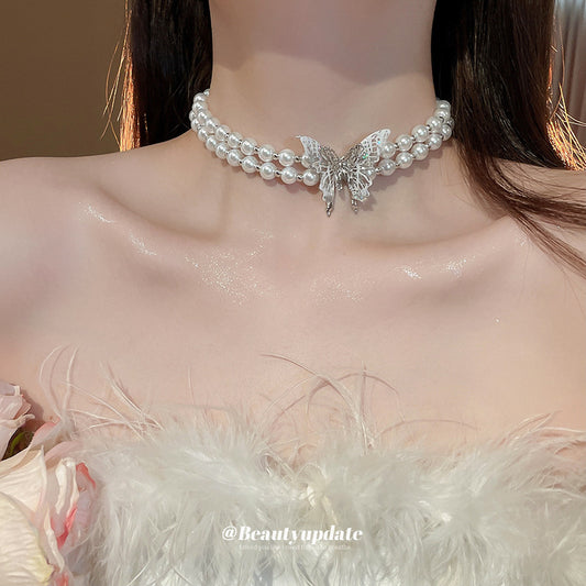 Elegante collana a farfalla a doppio strato in stile francese con perla imitazione e ciondolo in vetro per donna catena clavicola