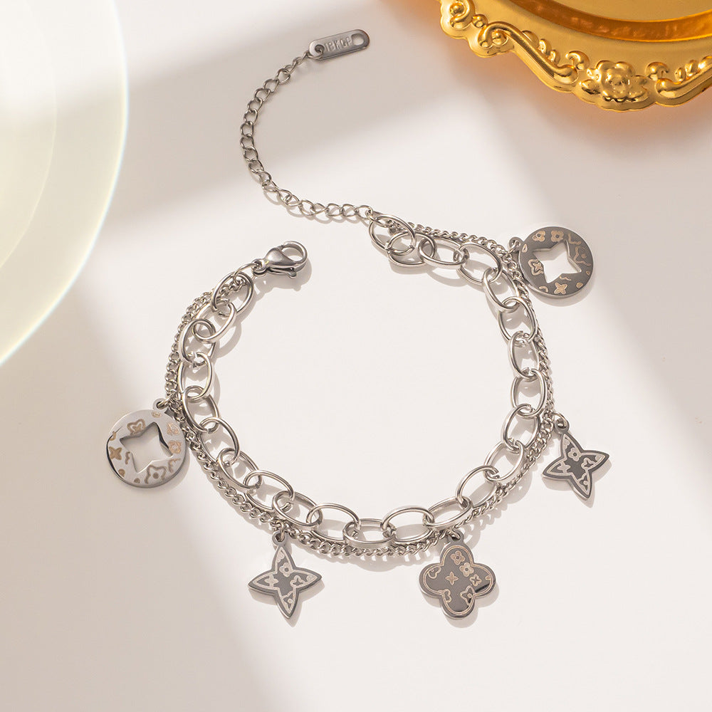 Elegante Pulsera Minimalista de Acero de Titanio con Colgante Redondo Bañado en Oro de 18K y Dije de Hoja para Mujer