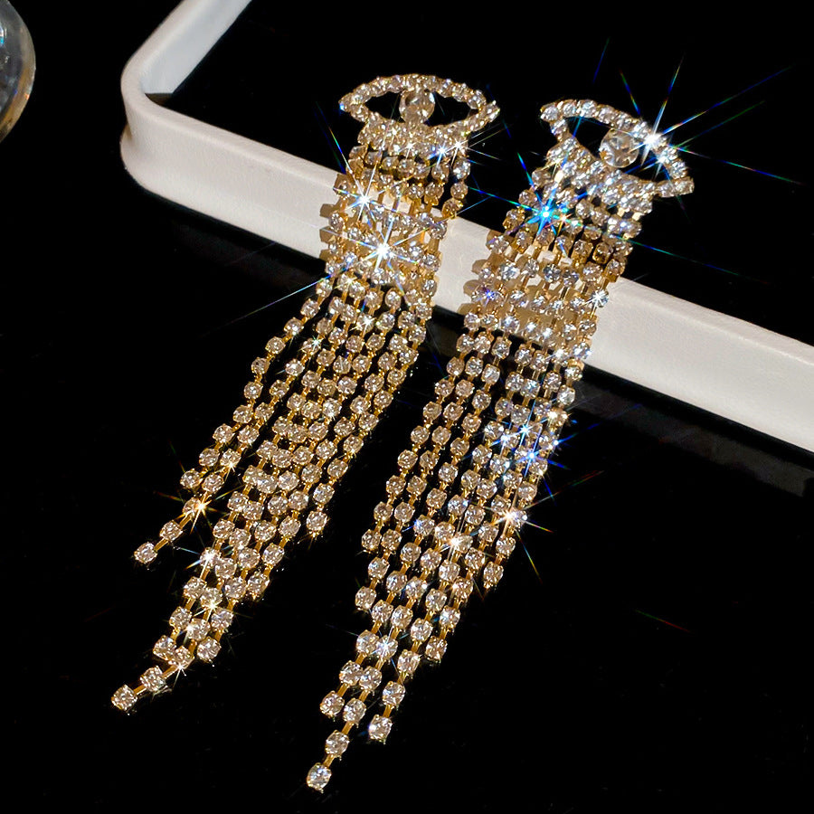 Pendientes colgantes geométricos elegantes en forma de rombo con incrustaciones de circonitas en base de cobre y postes de acero inoxidable para mujer