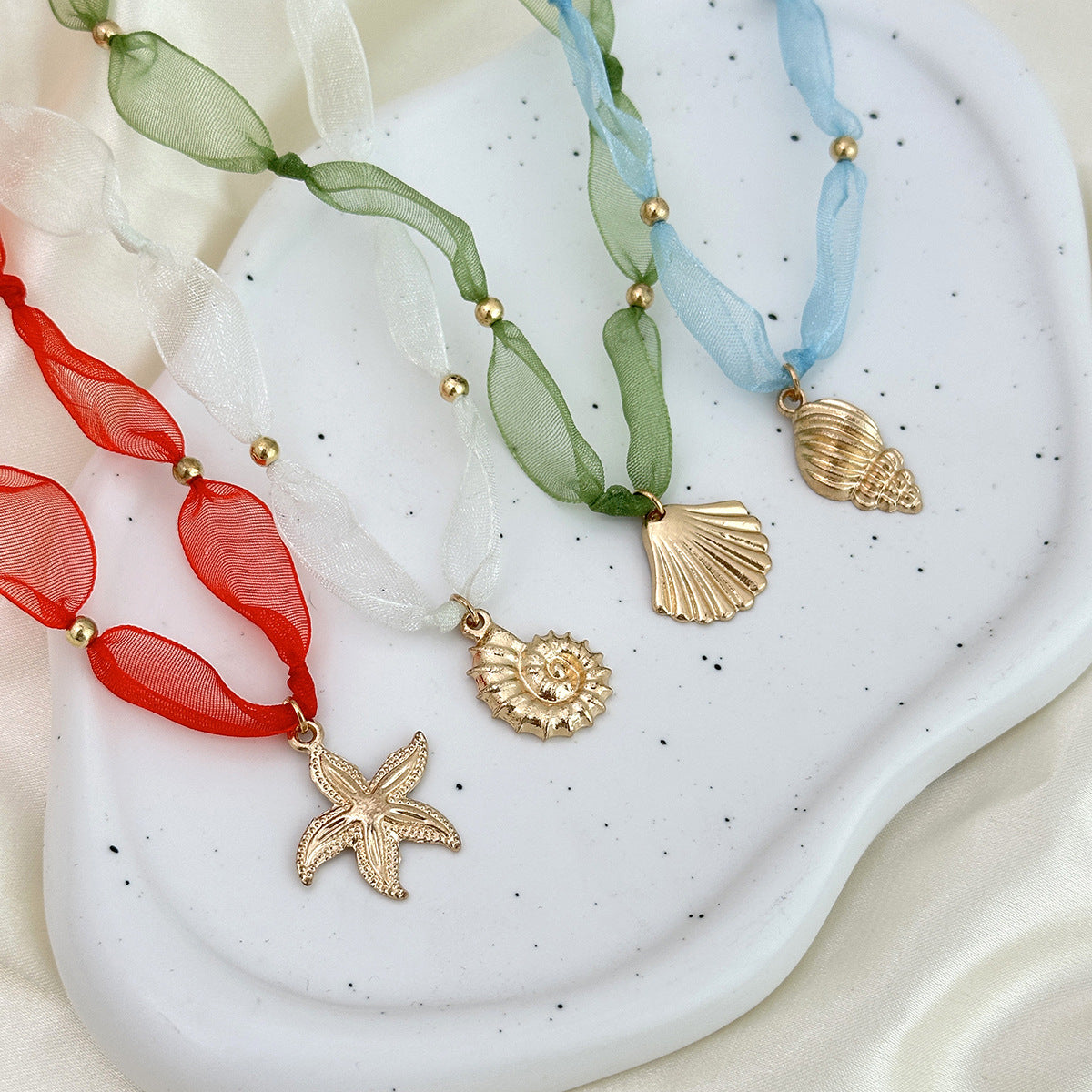 Minimalist Beach-Themed Star and Seashell Pendant Necklace in Alloy with Plated Finish for Women