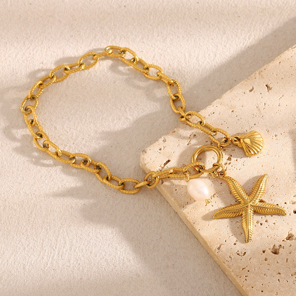 Cavigliera minimalista a forma di stella in acciaio inossidabile placcato oro 18 carati con accenti di perle da donna