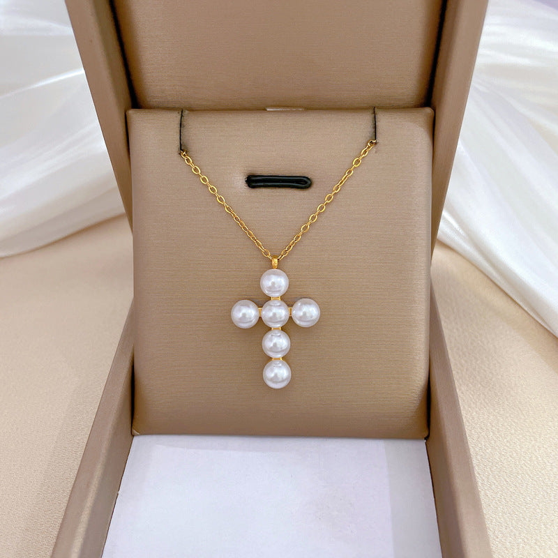 Collana a croce geometrica minimalista in acciaio al titanio con accento floreale