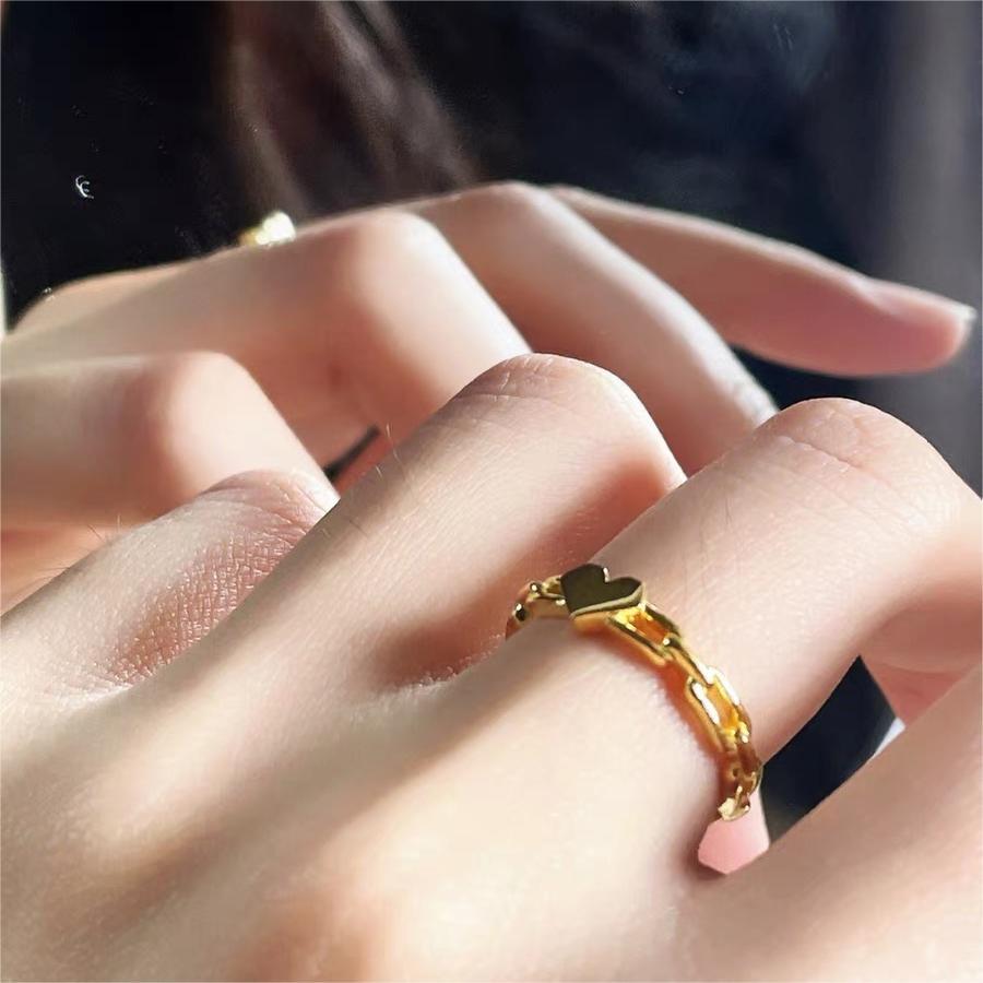 Sweet Minimalist Geometric Hollow Heart-Shaped Titanium Steel Ring with Gold Plating for Women