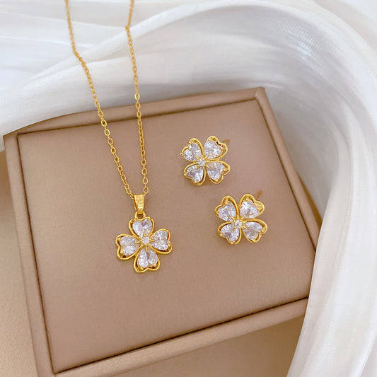 Conjunto de collar y pendientes geométricos de corazón y trébol de cuatro hojas de acero de titanio chapado de lujo para mujer