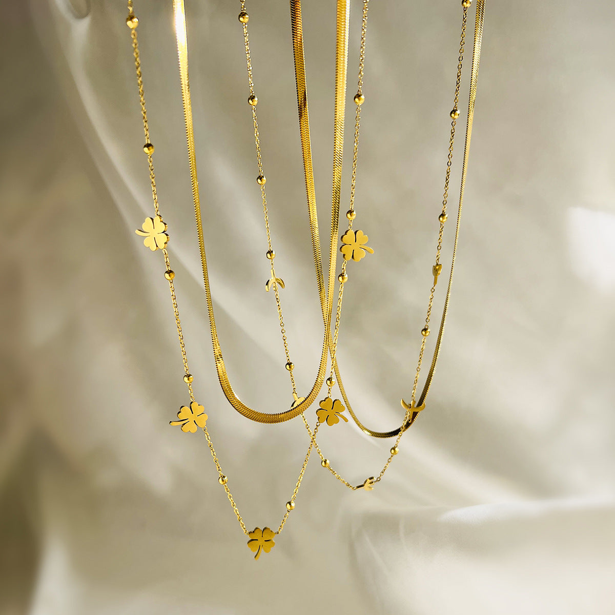 Minimalist Geometric Irregular Four-Leaf Clover Titanium Steel Necklace for Women with Double-Layer Aviation Design