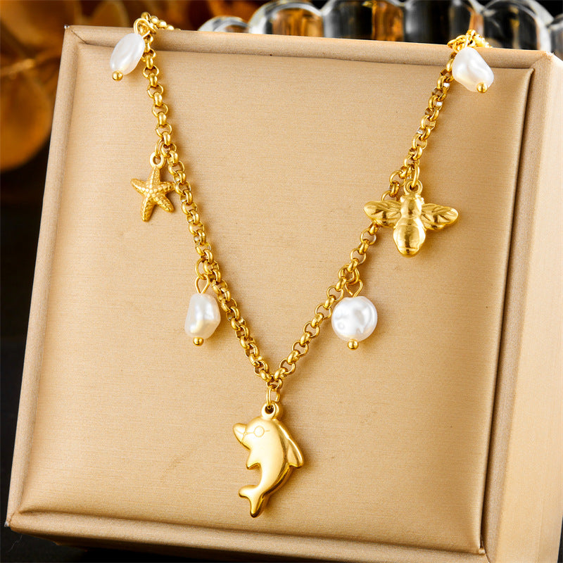 Collar con colgante de delfín, estrella de mar y perla, inspirado en el océano, de acero inoxidable, a la moda, para mujer, con cadena lateral