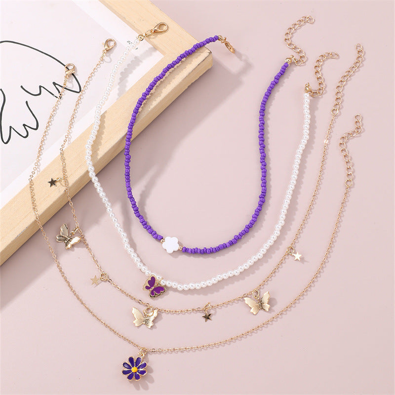 Set collana con pendente a farfalla rosa e floreale per bambini con perle in resina e ciondolo in lega, finitura smaltata, catena a sfere rotonde
