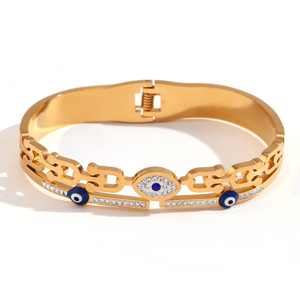 Bracciale minimalista di tendenza in acciaio inossidabile con placcatura in oro 18 carati e ciondolo a forma di occhio di Nazar micro-incastonato su chiusura a molla