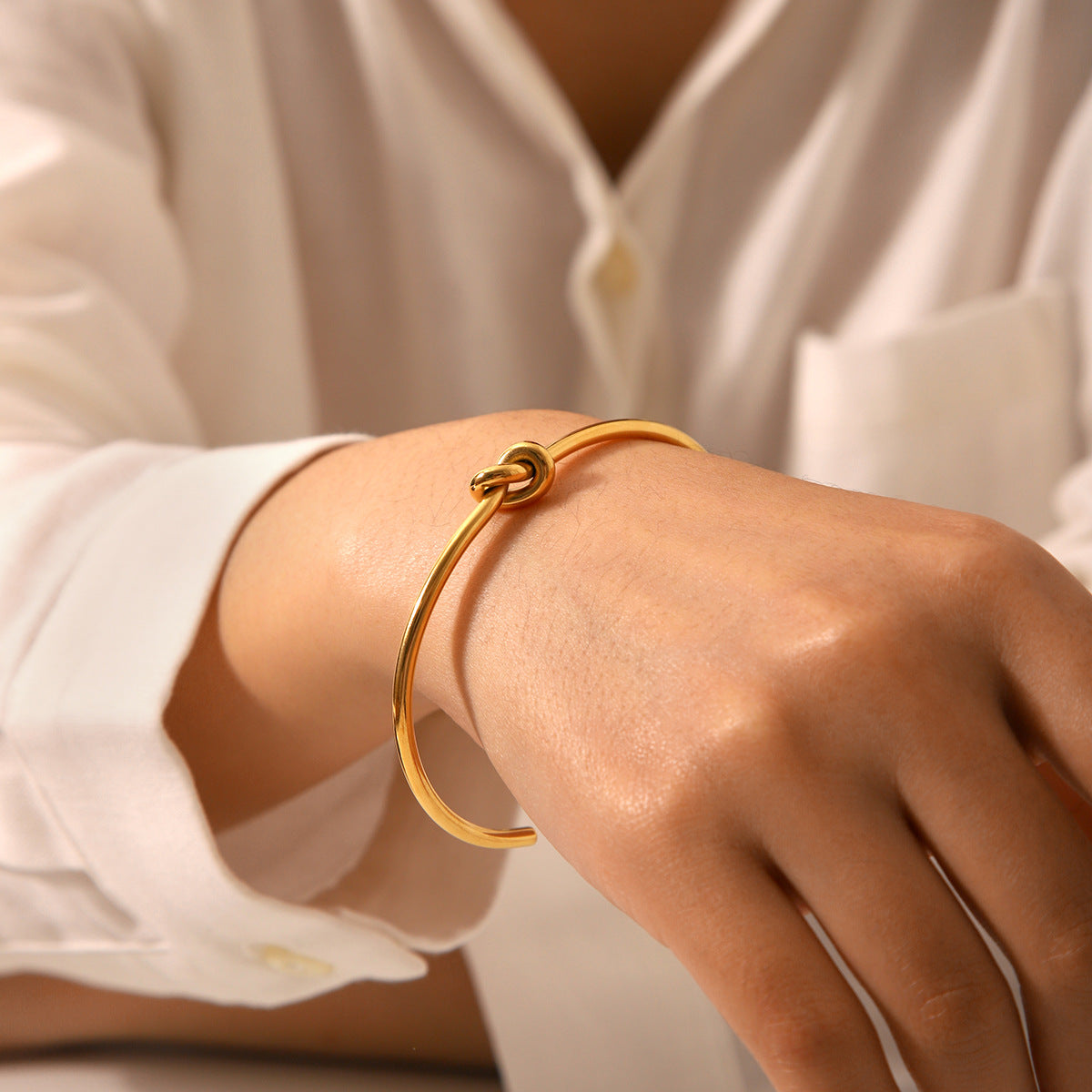 Minimalist Knot Design Stainless Steel Bracelet for Women with Plated Finish and Adjustable Open Bangle Style