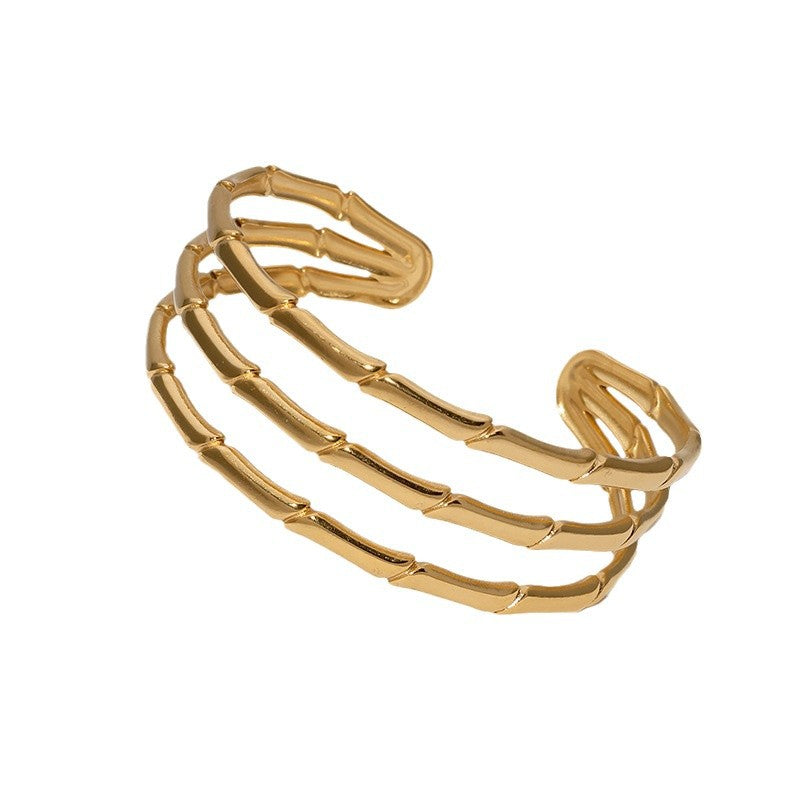 Bracciale minimalista a nodo di bambù in acciaio inossidabile placcato oro da donna con estetica fresca e delicata