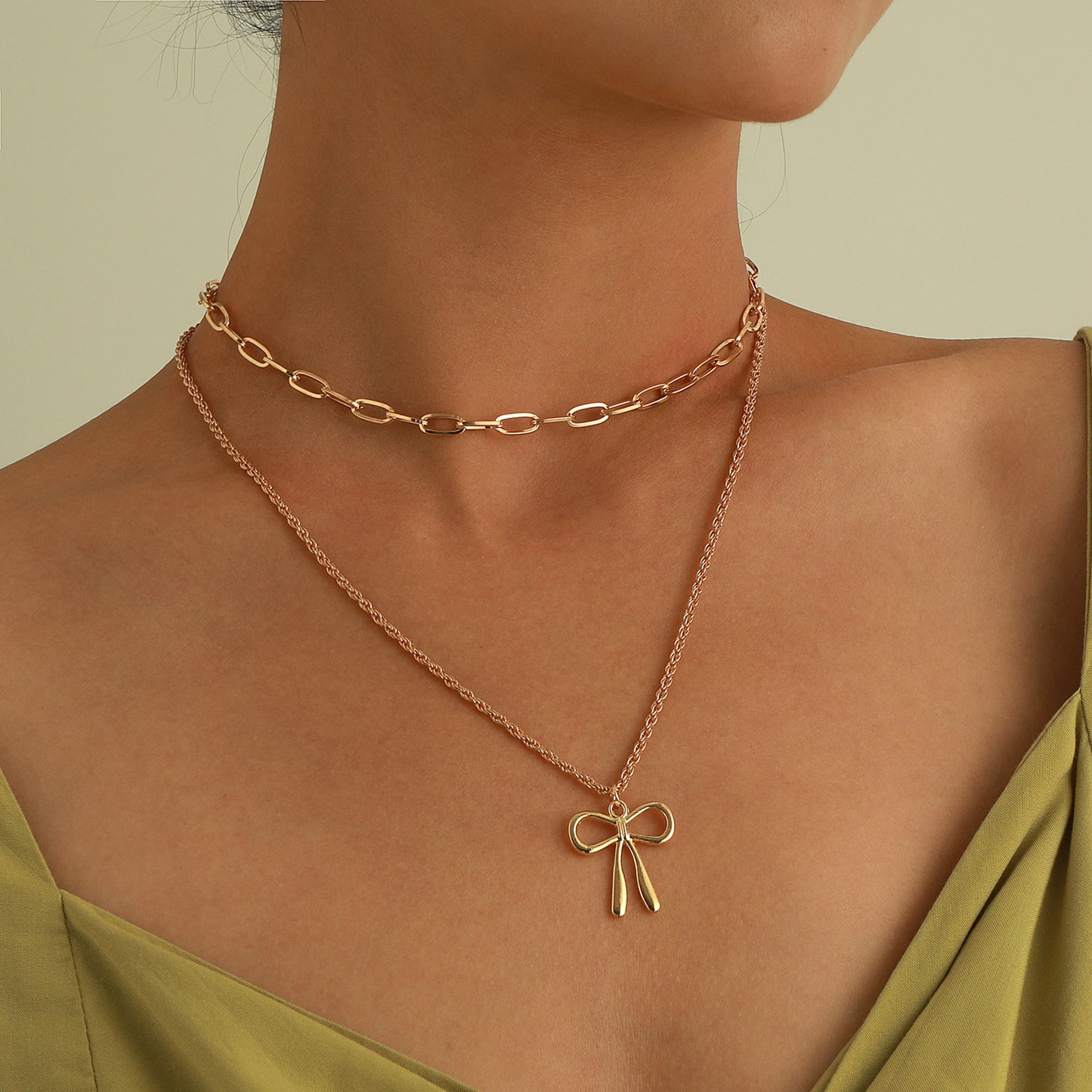 Punk Style Bow-Shaped Alloy Pendant Necklace with Plated Finish and Double-Layer Cross Chain