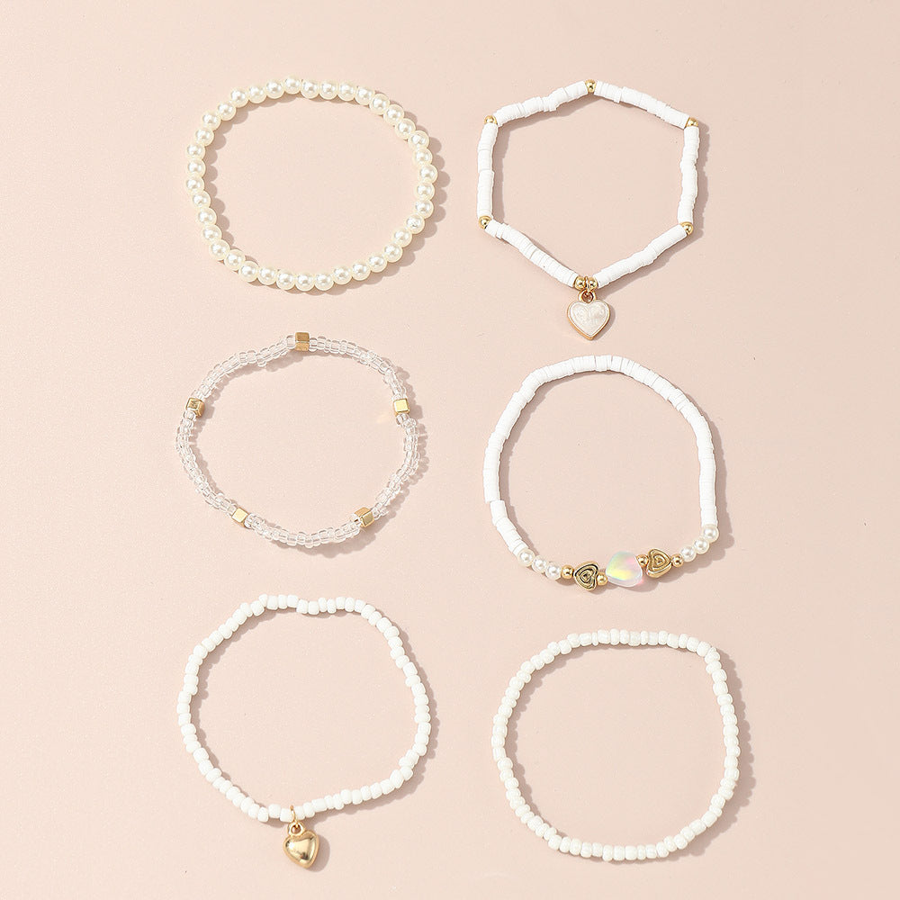 Set di braccialetti minimalisti con perline di vetro a forma di cuore per ragazze, con dettagli in perle e manifattura artigianale