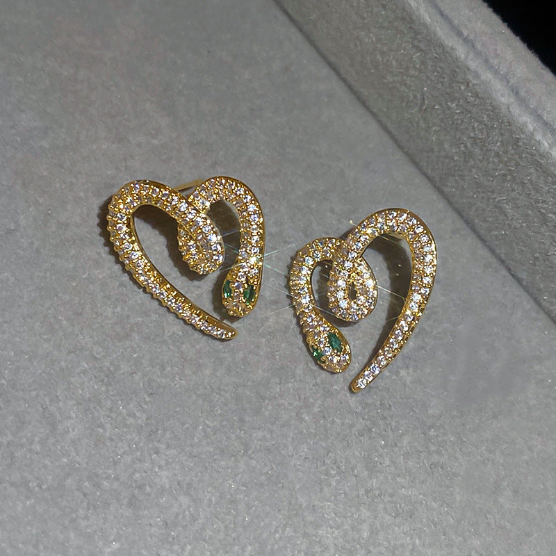 Orecchini a perno da donna chic a nappa con cuore geometrico occhio di tigre e intarsio di strass