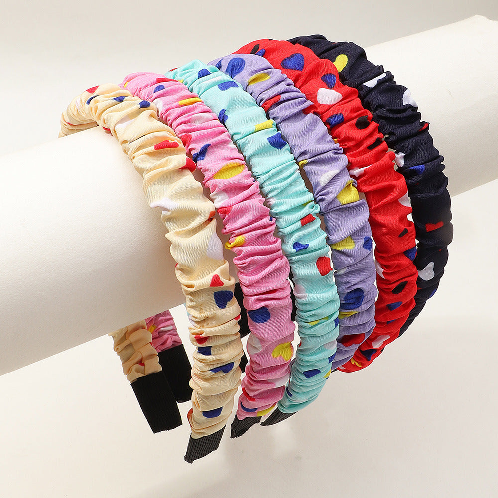 Bonita diadema de resina plástica con estampado de corazones para niños con acabado artesanal en forma geométrica