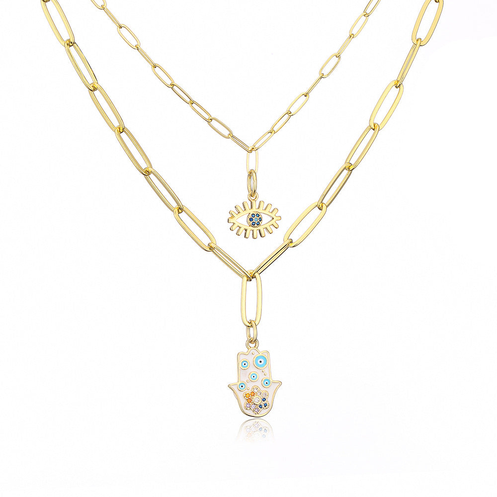 Collana con ciondolo minimalista a mano e occhio per donna in rame con finitura smaltata e intarsi in strass su catena placcata oro 18 carati