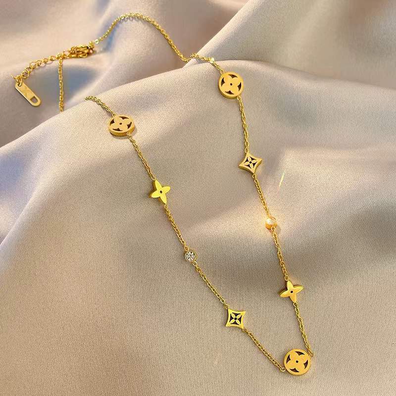 Minimalist Titanium Steel Hollow Four-Leaf Clover Necklace for Women with Electroplated Finish and Wavy Chain